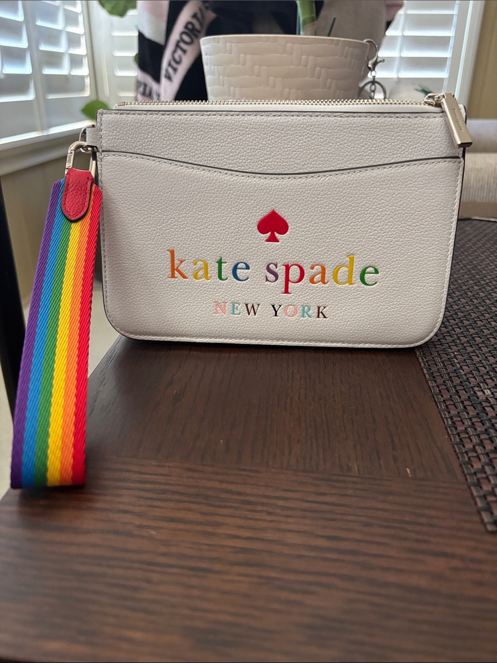 kate spade White Wristlet with Rainbow Logo and Strap